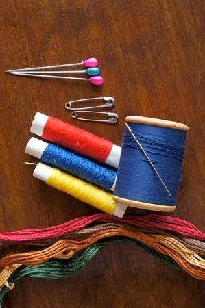 Sewing items with a vintage feel, thread, antique, pins and buttons
