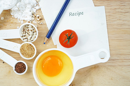 Millet, flour, eggs, sugar, tomato to make a cakeの写真素材