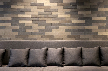 sofa in brick room and lighting on wallの写真素材
