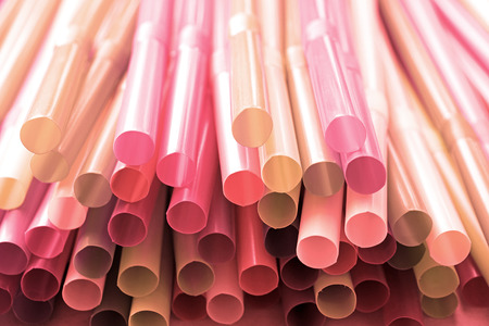 Plastic pale pink straw backgroundの写真素材
