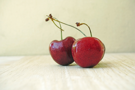 Cherries on wooden tableの写真素材