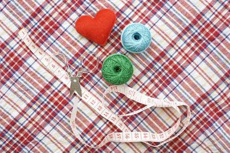 sewing kit, needles, thread and measuring tape