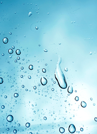 Waterdrops on a glass surface  Selective focus this imageの写真素材