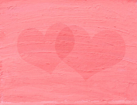 Heart shapes on painted pink wallの写真素材