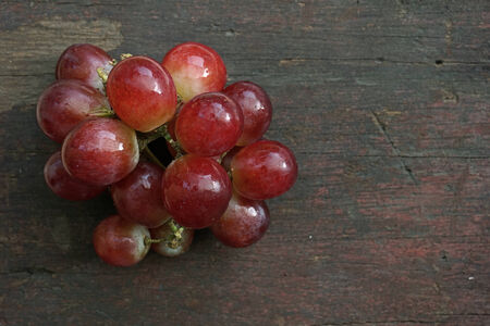 Grapes on a wooden tableの写真素材