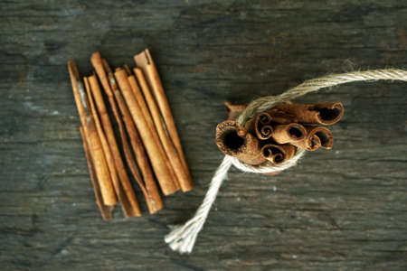 Cinnamon sticks on wooden backgroundの写真素材