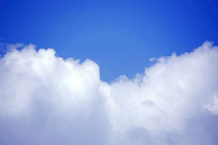 Cloudscape. Blue sky and white cloud. Sunny day. Cumulus cloudの写真素材