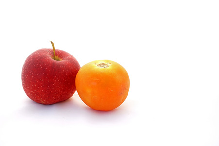 Tomato and apple isolated on white background