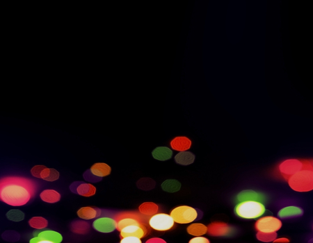 Abstract circular bokeh on dark backgroundの写真素材