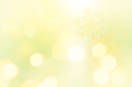 Snowflake on glitter yellow backgroundの写真素材