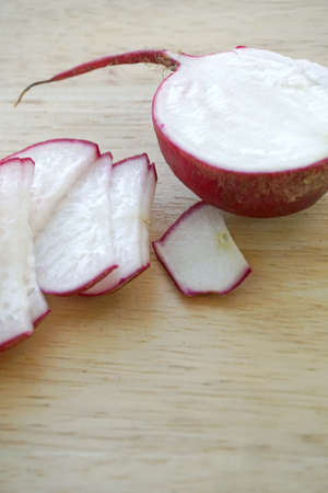 radishes on wooden tableの写真素材