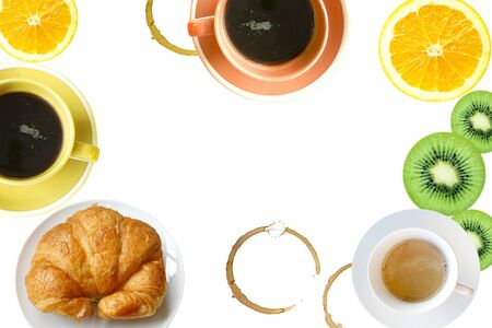 Breakfast concept. Coffee and oranges and fresh baked tasty croissant on white backgroundの写真素材