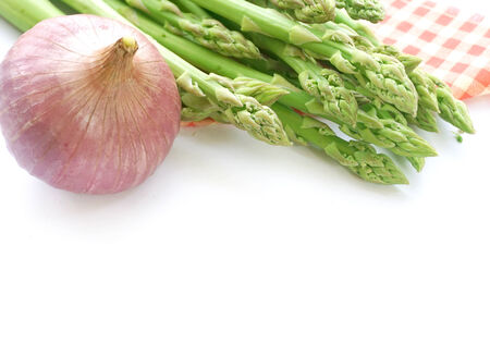 asparagus and onion on whiteの写真素材
