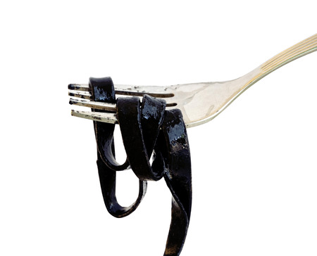 black spaghetti on white backgroundの写真素材
