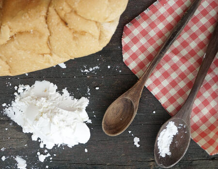 Freshly baked bread on wooden backgroundの写真素材