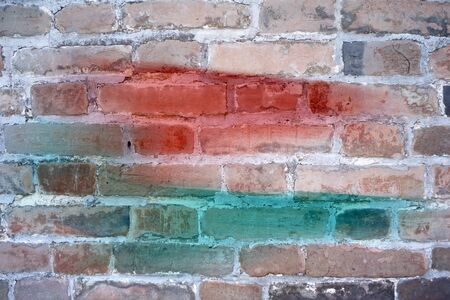 colors painted on grunge brick wall backgroundの写真素材