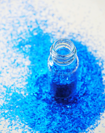 Glitters, Close up view of bottle of colorful glittersの写真素材