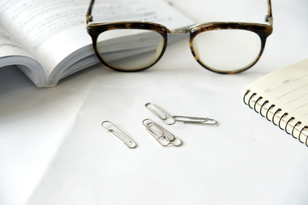 Pen notebook and eyeglassesの写真素材