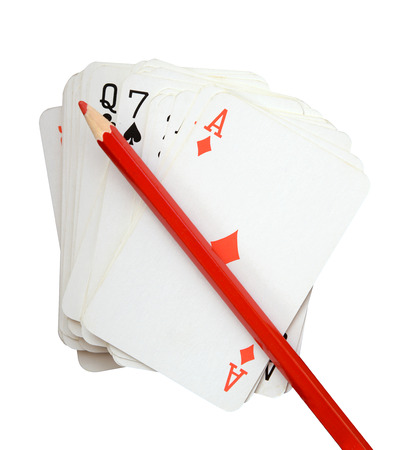 pack of cards with red pencil, isolate on white (clipping path)の写真素材