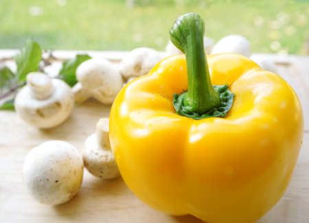 yellow bell pepper and mushroomsの写真素材