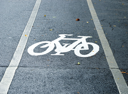 bicycle lane sign on the roadの写真素材