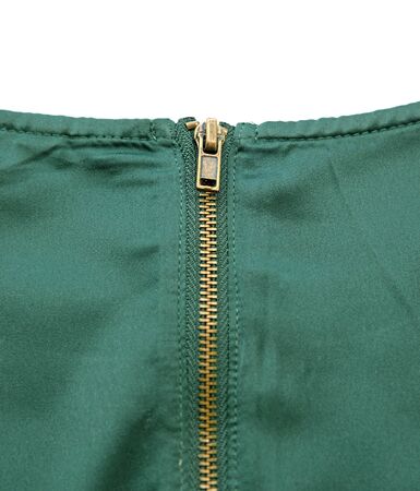 Gold Zipper on Green Silk Clothの写真素材
