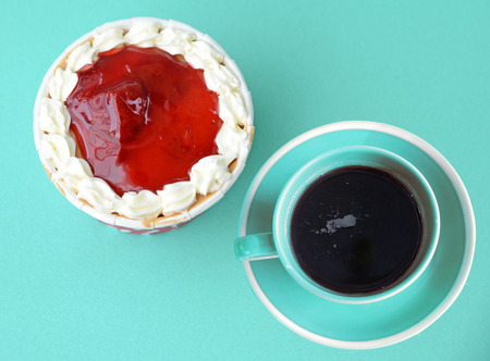 cupcake and coffee top view on blue backgroundの写真素材