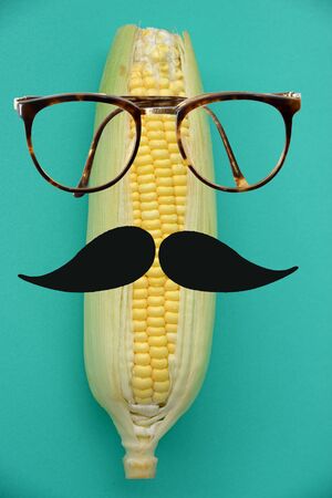 Fresh corn with hipster characterの写真素材