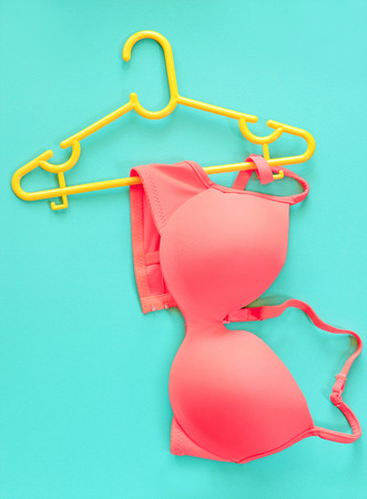 Summer concept, bra on coat hanger on blue. (Pop art style)の写真素材