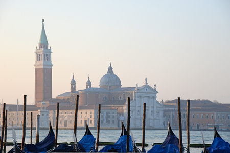 Gondolas moored by Saint Mark square with San Giorgio di Maggiore church in the background - Venice, Venezia, Italy, Europeの写真素材