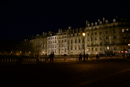 PARIS - APRIL 14: Panoramic photo of several parisian buildings at night time on April 14, 2015 in Paris, France.のeditorial素材