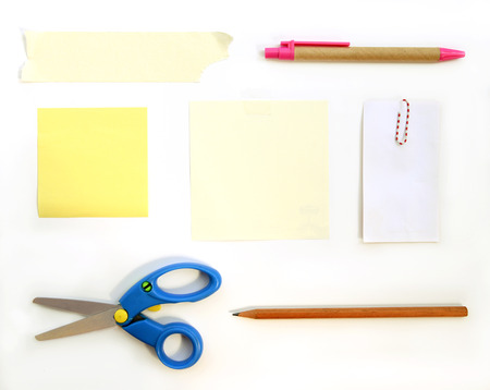 stationery supplies scissors note paper pen pencil paper clips and tape on white backgroundの写真素材