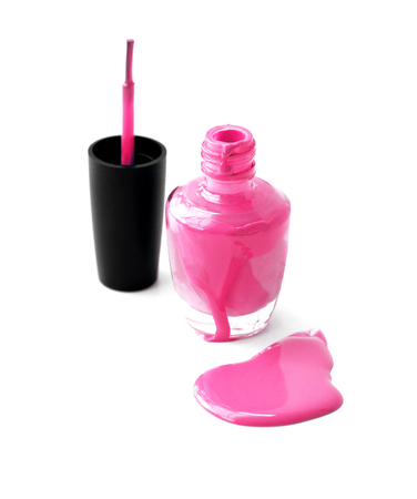 Pink nail polish and brush on white backgroundの写真素材
