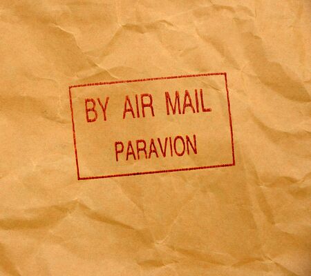 par avion grunge stamp on crumpled paper backgroundの写真素材