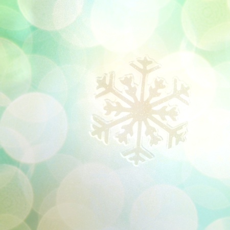 Winter holiday snow flake colorful background, bokeh.の写真素材