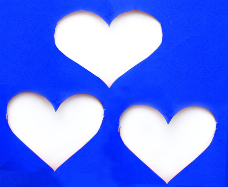 Stack of blue torn paper in heart shape symbol over white backgroundの写真素材