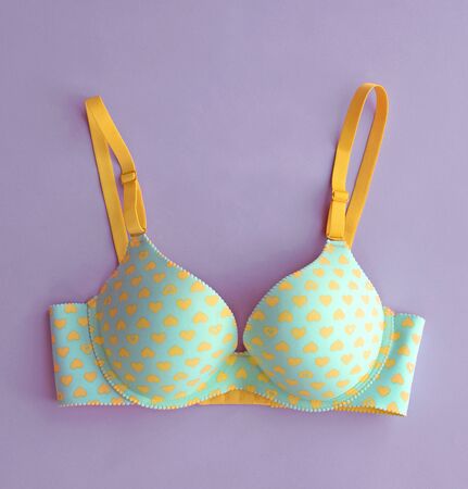 bra on purple background (pop art)の写真素材
