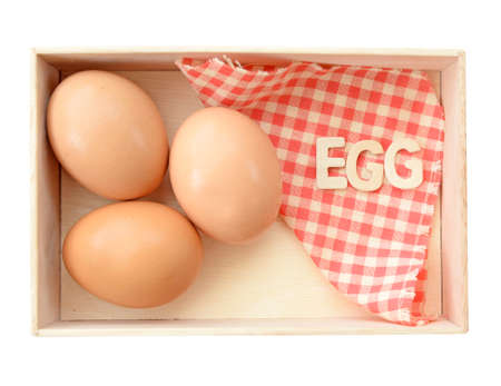 Isolate wooden box with eggs (clipping path)