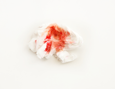 Blood on tissue on white backgroundの写真素材