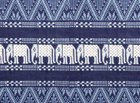 Texture of blue cotton fabric, with white woven fabric elephant