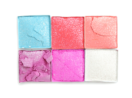 multicolored crushed eyeshadows isolated on white backgroundの写真素材