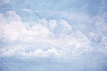 Blue sky with some white puffy clouds, Vintage tone.