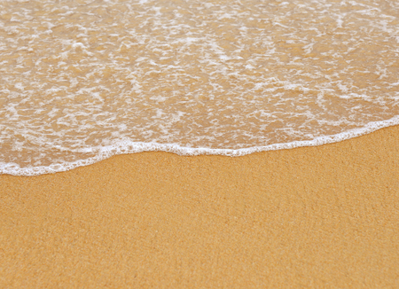 Wave on the sand beach backgroundの写真素材