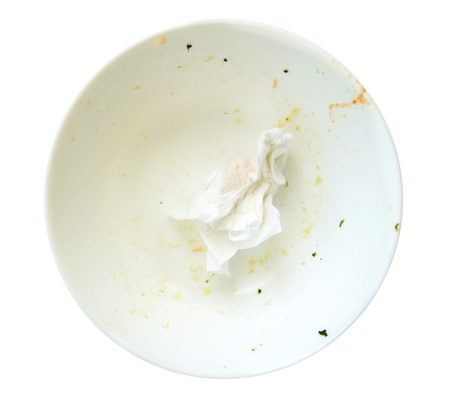 leavings on a white dish, isolate on white.の写真素材
