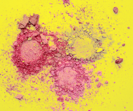 colorful powder on yellow background