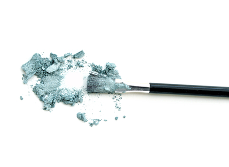 Make-up brush with colorful crushed eyeshadowsの写真素材