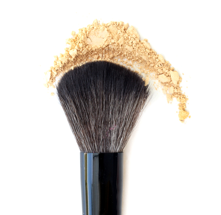 Makeup brushes and powder in motionの写真素材