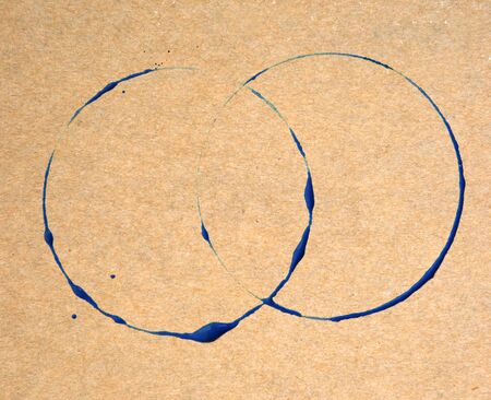 blue ring stains on brown paper texture backgroundの写真素材