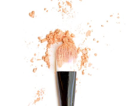 orange make up color with brush, crushed make up color.