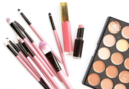 Various makeup brushes and lipstick set on light background (Vintage tone)の写真素材